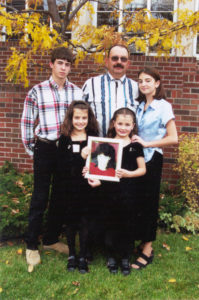 Frank Ropp and his four children with a photo of their mother, Mary, who was a donor in 2000. Photo taken in 2001